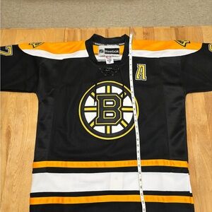 Reebok Black and Gold Boston Bruins Bergeron jersey. Brand new with tag.